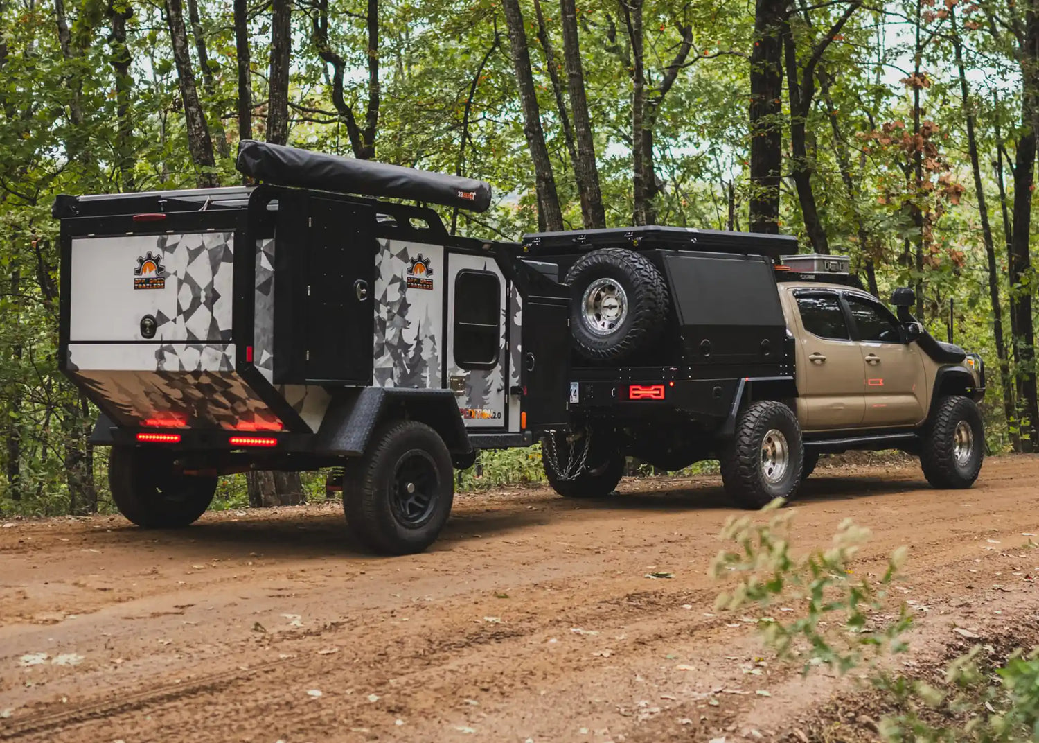 Tacoma towing an overland trailer in the Ozarks after getting a tow hitch installed at Starwood Custom Vehicles in Northwest Arkansas