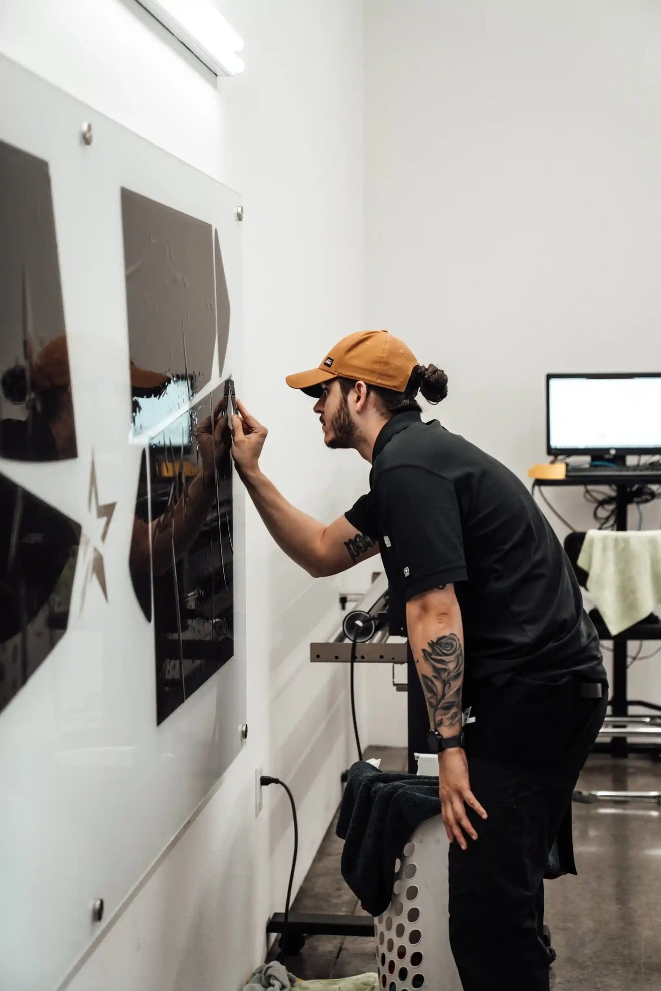 Automotive window tinting technician prepping a custom car window tint installation at Starwood Custom Vehicles auto shop in Northwest Arkansas | serving  Springdale, Rogers, Bentonville, Fayetteville, and the greater NWA area
