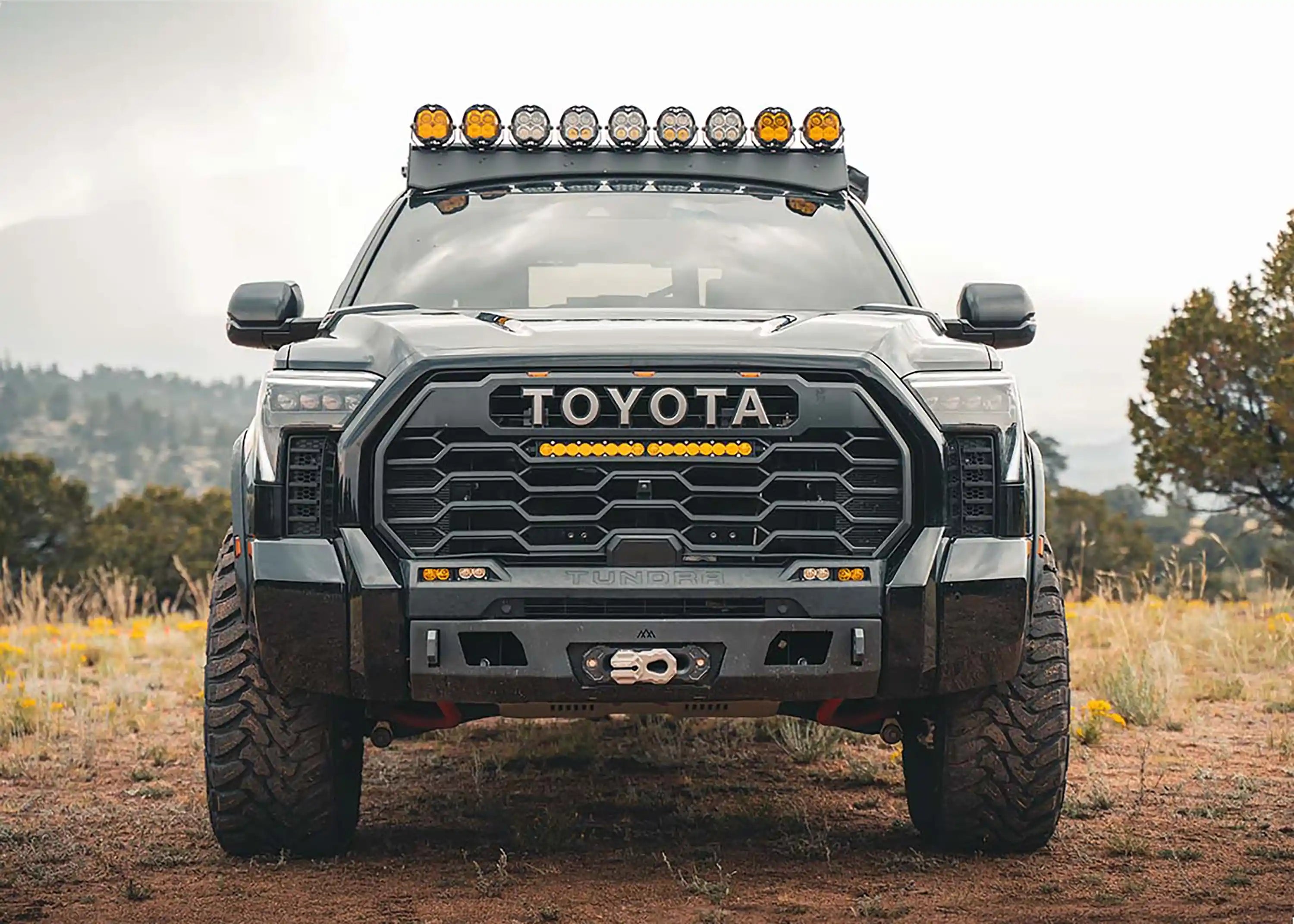 Truck outfitted with off road winch bumper, lights, skid plates, and rock sliders at Starwood Customs shop in Northwest Arkansas providing Springdale, Rogers, Bentonville, Fayetteville, and the surrounding area